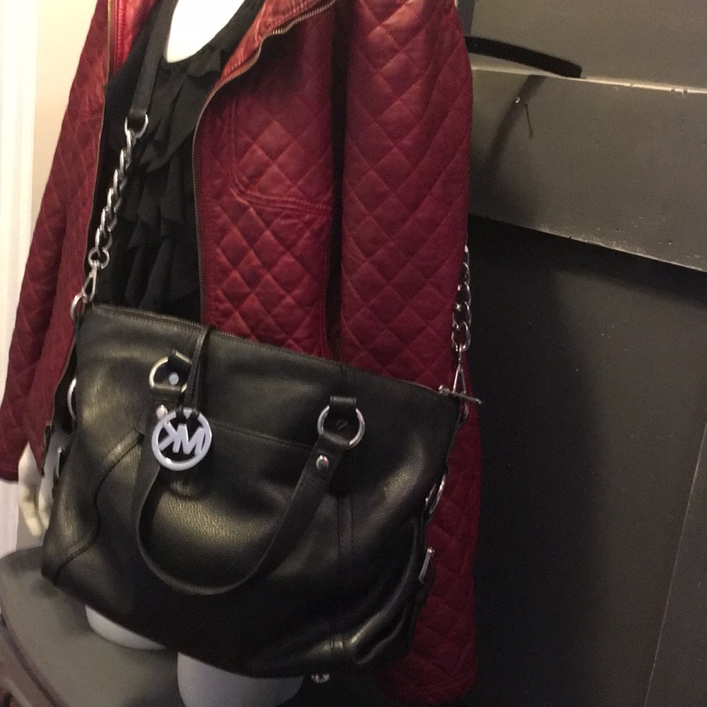 Micheal Kors black bag . Gently used .